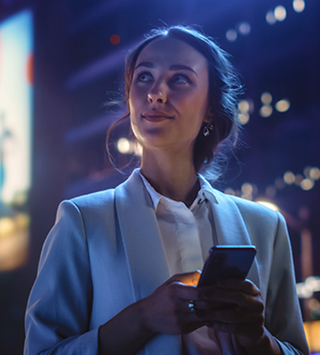 Image of woman with phone for IP Group Case Study on Featurespace exit